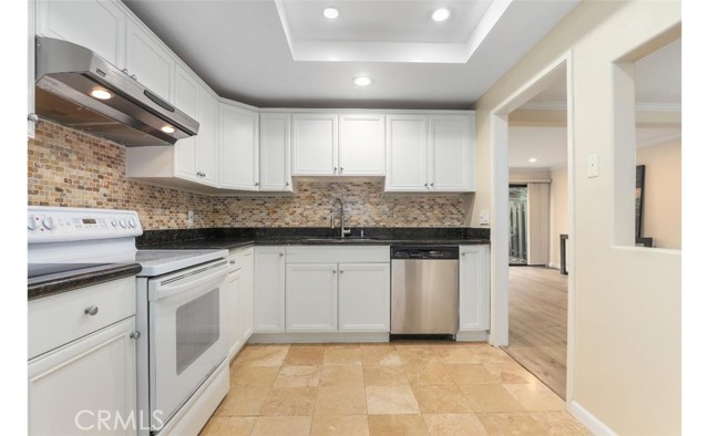 Remodeled kitchen leading to the dining space.