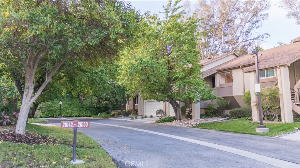 *This beautiful townhouse is nestled in one of Santa Clarita's most sought-after gated communities, Scenic Hills* Here are just a few of its many fine features: Lush landscaping and rolling greenbelt offering eye catching curb appeal * Step into a flowing 1,268 square foot open tri-level floor plan with high ceilngs, recessed lighting* Easy care laminated flooring* Spacious living room is bathed with natural light and has a cozy gas-burning fireplace and direct patio access*The family's cook is going to appreciate the kitchen abundant cabinets, pantry, ample quartz counters with subway tile full back splash, deep basin stainless steel sink, built-in appliances, and convenience of the adjoining dining area. Two bedrooms; The grand suite has a private balcony, walk-in closet and well appointed bathroom* Two bathrooms* Central air & heat for year around comfort* 2 car garage with laundry hook-ups and direct acess to unit* You're going to experienes "Resort-Style-Living with the community club house, gym, tennis courts, Pool, spa, golf coarse and more! Great location close to schools, grocery stores, shopping!