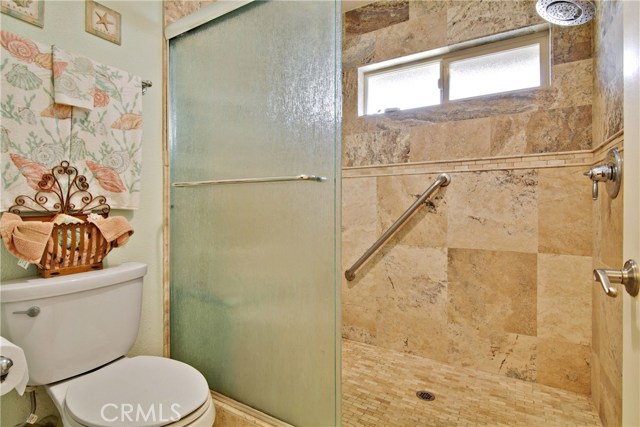 Stone shower and rain glass door