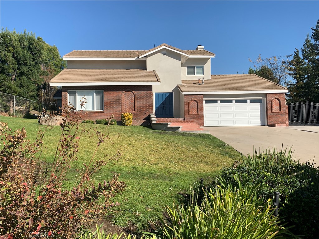 This stunning home is located on a quiet street at the foothills of Rancho Cucamonga that features 5 bedrooms, 3 bathrooms, with a great floorplan. Home sits on huge lot at the end of the cul-de-sac. Upgraded bathrooms and flooring throughout the home. Downstairs you'll find a large bedroom and two bathrooms. In the kitchen you have granite counter tops, granite back splash, a breakfast bar, stainless steel appliances, garden window and a breakfast nook. The master bedroom suite features a private balcony, with an upgraded bathroom. Huge backyard that's perfect for entertaining with a beautiful brick patio, lattice cover, landscaped paths, and space for a pool. Home has a large laundry room with plenty of counter space.