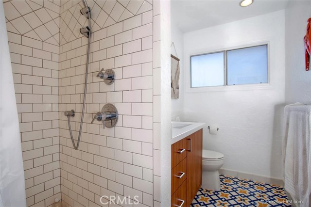Guest bathroom has shower.