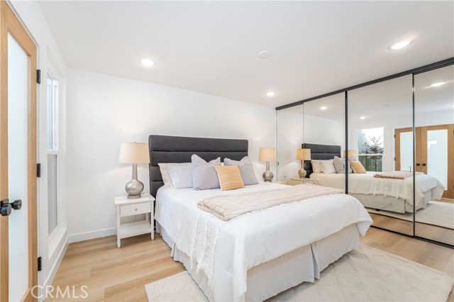 Large bedroom with lots of closet space and organizer, recessed lights in the room and in the closet as well as ceiling fan pre-wire.