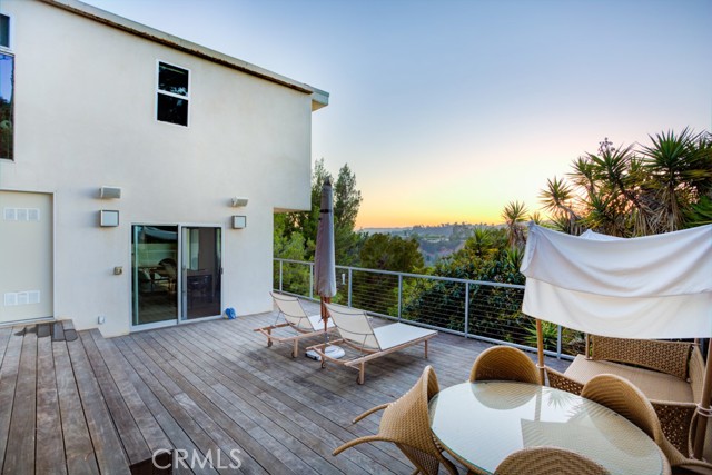 9373 Claircrest Drive Beverly Hills, California BUY THIS HOME AND TRADE! Stunning designer home in Beverly Hills 90210! This gorgeous, fully renovated home is located in a quiet cul-de-sac with phenomenal views! The entire property is custom designed by Gerhard Heusch Architecture & Wick Architecture, with design and project management by James Devens NYC. The home features a custom open floor plan with a Bulthaup kitchen, Ceaserstone counters, and a Gaggenau cooktop. The kitchen includes a SubZero fridge and freezer, Miele dishwasher, and Franke stainless steel sink with faucet. The main living room boasts a gas fireplace with custom hardwood floors and woodwork by Zook Woodworking. The luxurious master bedroom with walk-in closet also has a steam shower and towel warmer. The outdoor living area is like having your own private oasis with a built-in grill and fridge on the island counter, perfect for entertaining. Just minutes away from the Beverly Hills Flats and Rodeo Dr. for convenient commuting and shopping. This amazing home is move-in ready! Disclaimer: Tax data shows 3 bedrooms, home has an additional room that may be converted into a 4th bedroom. All information deemed reliable but not guaranteed.