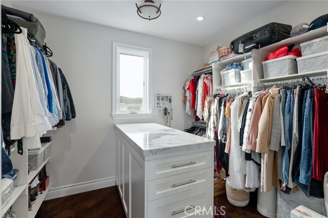 oversized walk in closet with built in dresser