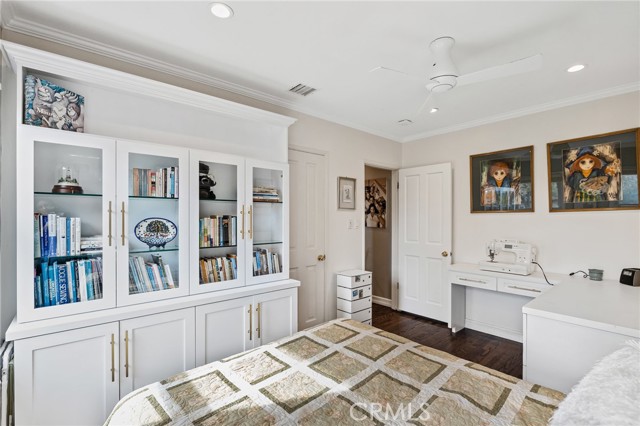 A 2nd view of the 2nd bedroom with built-in cabinetry.