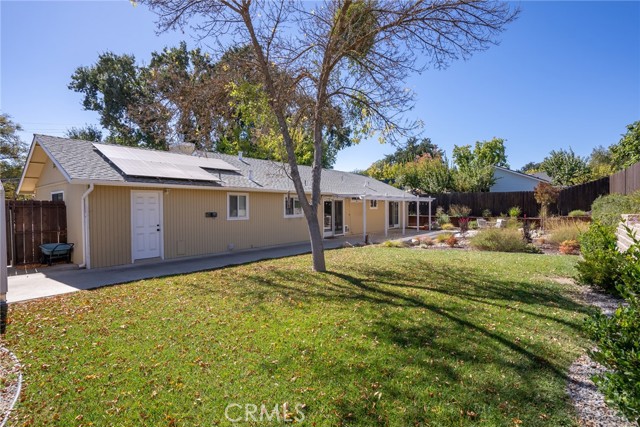 The backyard offers a generous lawn area with mature shade tree ready for hours of fun!