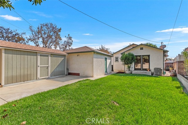 Backyard with 2 Car Garage and additional large storage shed all behind a private gate fence