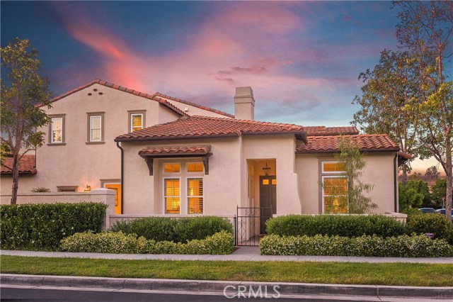 117 Vermillion Irvine, California Nestled in one of Irvine's most desirable hillside communities, this beautifully upgraded Quail Hill home is located on a quiet street, and just steps to immaculate parks, the community fitness center and pool, Alderwood Elementary, and Orange County's most popular wilderness hiking trails. Ideally situated on a corner lot, awaits a home of style and comfort. Highly desirable open floor plan with main floor master bedroom. Highly upgraded kitchen open to dining room. New designer paint throughout interior of home. Home is ideally located on quiet street close to parks, award-winning Irvine schools and shopping center a few blocks away. Enter this home and enjoy a spacious living room with fireplace and plenty of oversized windows for natural light. Downstairs also boasts large den which could be used as a 4th bedroom with full bath downstairs. Rich hardwood flooring. Gourmet kitchen with granite counter tops and comfortable breakfast seating area.Custom built-in bookcase & entertainment center in den. Downstairs master bedroom w/ bath, shower and spacious walk in closet. Direct access 2 car garage. Beautifully landscaped private yard, fully enclosed, professionally-designed patios for entertaining or private relaxation with a cup of coffee and a good book. Only 7 miles from Laguna Beach. Quail Hill offers a sense of community to connect with others and call home for many years to come.