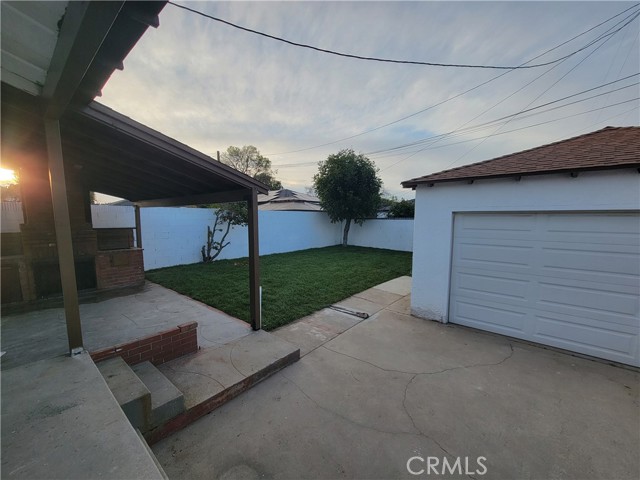 Rear Yard with Covered Patio and Detached Garage
