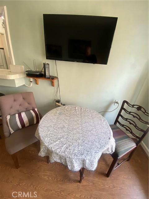 Folding leaf dining table with 2 chairs.