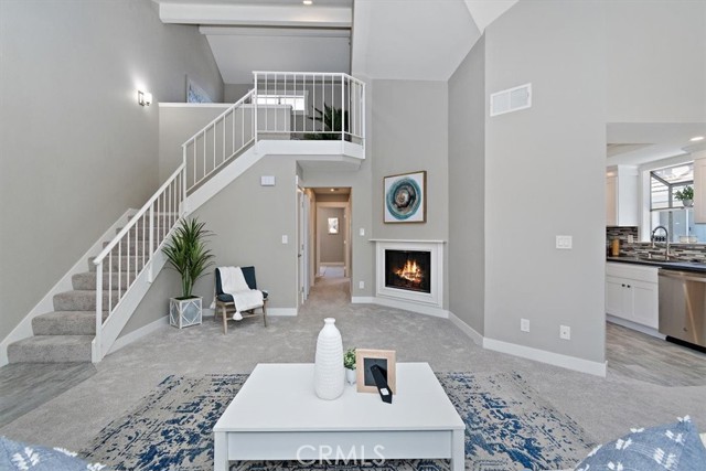 26774 Claudette Street 404 Canyon Country, California Beautifully remodeled and updated 2 Bedroom, 2 Bathroom + loft! This open and spacious upper unit with soaring ceilings has a serene view of trees, hills and the resort style community of American Beauty Village! The loft is the perfect space for a home office and the private balcony is perfect for your morning coffee. You will love the remodeled kitchen with stunning quartz counters, white shaker style cabinets, beautiful backsplash and the new stainless steel appliances (Range, Microwave & Dishwasher, refrigerator). The inside laundry and the 2 car garage will make life easy. Both bathrooms are remodeled with luxurious quartz counters, vessel sinks, shaker cabinets and beautiful tile. This community has many great amenities that include: pools, spas, playgrounds, picnic areas, tennis courts, and picturesque greenbelts and walking paths that are perfect for your evening walks. The HOA includes water, trash, sewer and maintenance of the grounds. Easy access to the 14 freeway and Metro link and convenient to shopping and restaurants as well as the dog park, skate park, bike park and the Santa Clarita Aquatic Center. This beautifully remodeled unit in this sought after neighborhood will not last long! Call and Tour today!