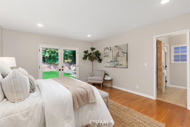 Main Bedroom with French Door Walk Out to backyard, En Suite and walk in closet