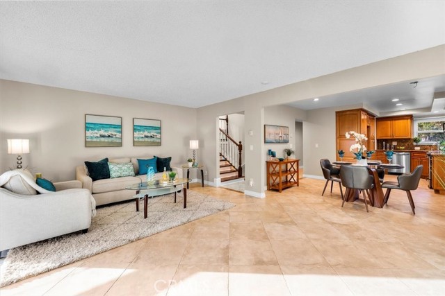 Tile floors on entire entry level. Sunny and bright living room, dining area and kitchen.