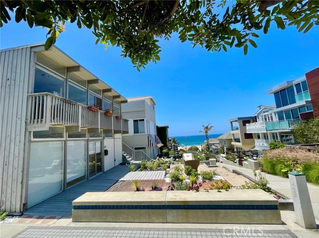 Walkstreet view of corner lot and ocean/beach view.