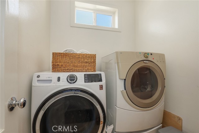 Laundry room also upstairs in between 2 bathrooms.