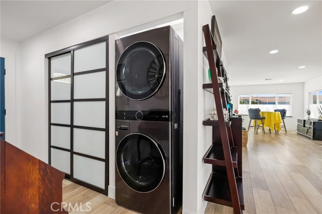 Storage closet with cool doors, and top o the line washer & Dryer...
