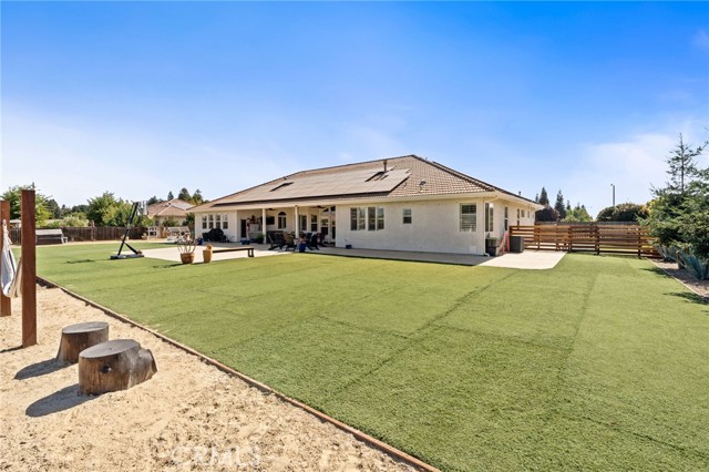 back area with 5,000 SF of turf- offering low mtce living!