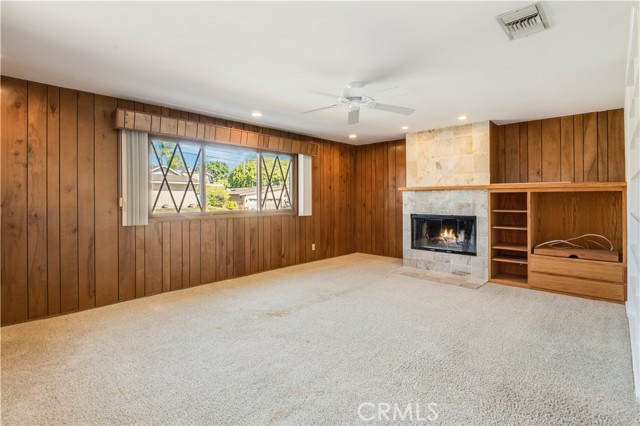 Family room off the kitchen, good for a home office?  There's even a large deep closet that has been used for a hide-away office.  Homework area?