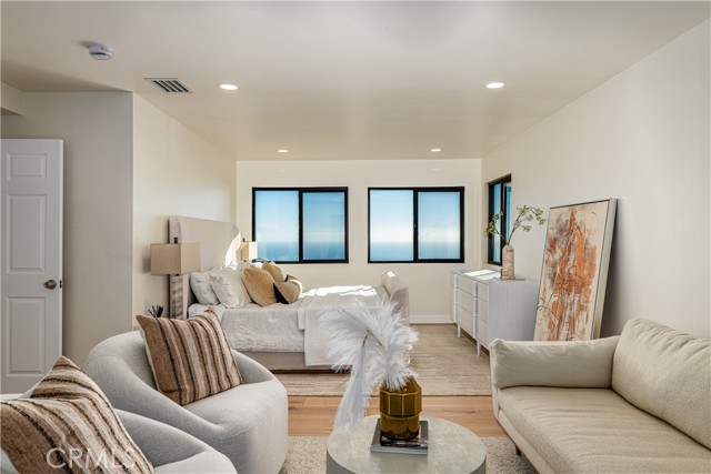 Ocean view primary Bedroom with seating area