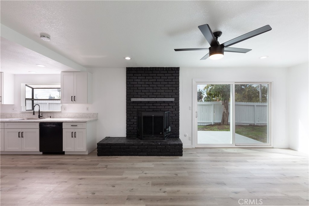 Dining Room with Brick Fireplace attached to kitchen