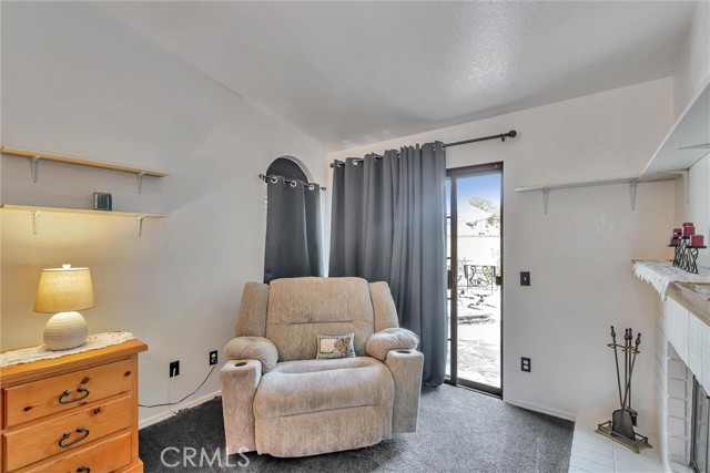 Sitting area of the primary bedroom including fireplace!