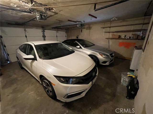 Double door 2 car garage.  Laundry in garage.  Additional 2 car parking spaces outside garage doors on driveway on Manhattan Avenue.