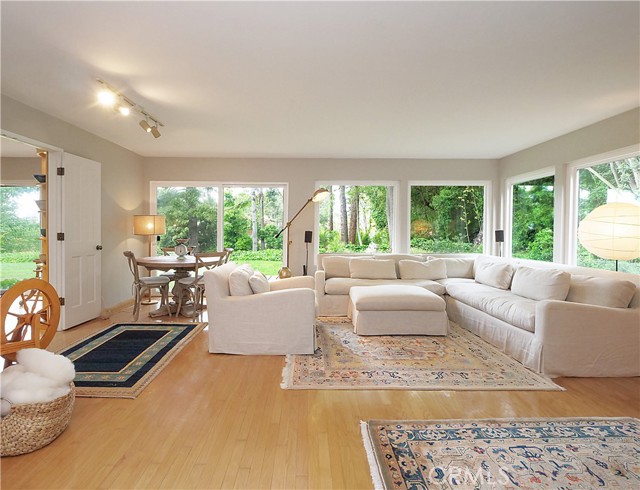 Feel like you are in the forest with the walls of glass and the gorgeous wood floors.