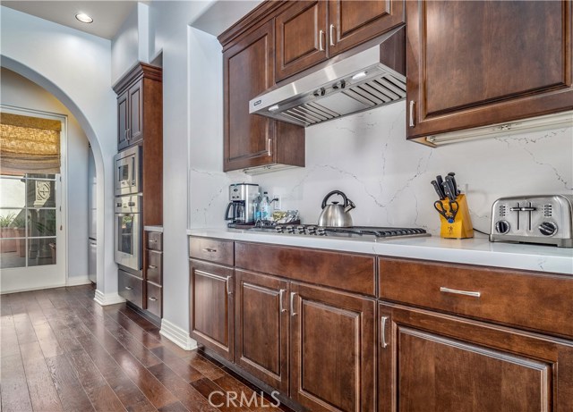 Gleaming quartz countertops highlight the custom cabinetry