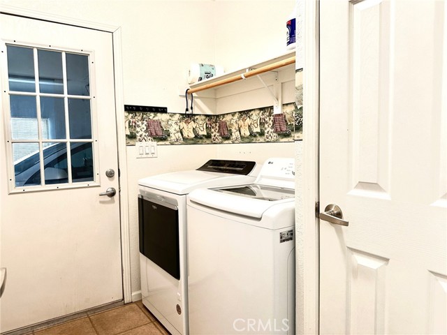 Laundry room next to garage