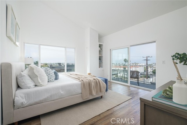 Primary bedroom with 180 degree panoramic views of the ocean and Palos Verdes. Soaring high ceilings.Private balcony with incredible views.