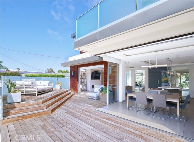 Elevated deck seating with glass enclosure.