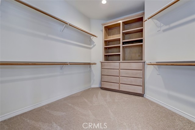 Huge walk-in closet with built-ins in the primary suite