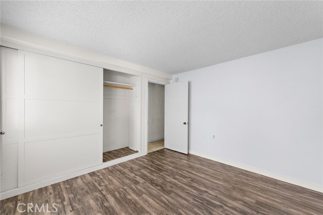 Master bedroom with lots of closet space and easy cleaning with the laminate vinal grain flooring.