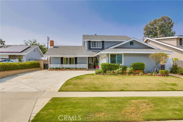 24782 Lobo Drive Lake Forest, California Charming and spacious home located in the desirable Laguna North subdivision in Lake Forest, ideally located on a family friendly street, within walking distance of dining, shopping, and local schools. Blessed with gorgeous curb appeal, colorful manicured landscaping, and a well-maintained exterior all creating a great first impression. The double door entry welcomes you inside where the light and bright newly painted interior, sleek vinyl wood floors, plantation shutters, and vaulted open beam ceilings create an ideal living environment. The spacious floorplan includes a formal living room with cozy fireplace, formal dining area, expansive family room with impressive brick fireplace and direct access to backyard and patio, plus 2 bedrooms and a full bath on the lower level. The sunny kitchen has been beautifully updated with granite countertops, stainless steel gas range and oven, updated faucet and fixtures, prized breakfast bar, and fridge included. Bathrooms upstairs and down, have been beautifully remodeled with granite topped vanities, framed vanity mirrors, updated fixtures and lighting, upgraded cabinetry, and step-in showers with glass tile surrounds and frameless glass shower enclosures. 3 additional guest bedrooms upstairs with gorgeous wood laminate floors and mirrored closet doors. Expansive peaceful and private backyard with lawn, patio, and picturesque landscaping perfect for relaxing and entertaining. 2 car garage with electric car charging station.