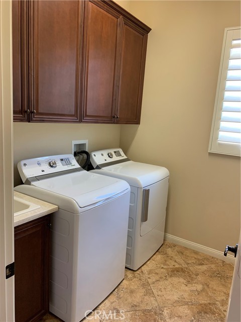 laundry room with washer/dryer included
