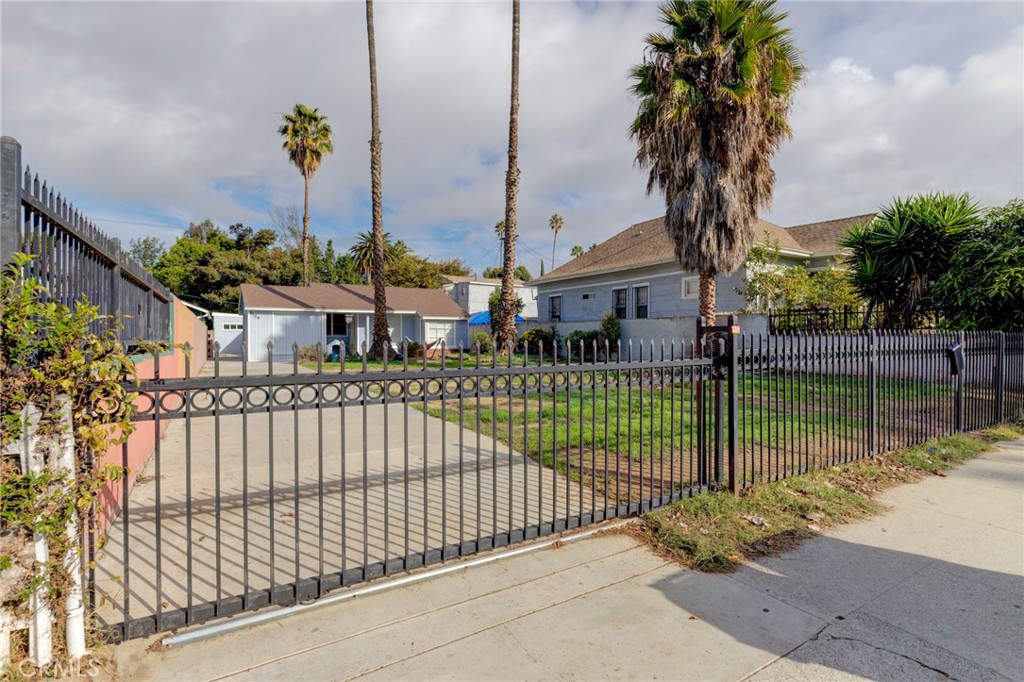 2159 W 27th Street Los Angeles, California Wonderful move-in ready opportunity! Located in the Jefferson Park area, this up-to-date remodeled single-family home on an R4 lot features 3-bedrooms, 2-bathrooms and a bonus room/office. The huge front yard has potential for building multiple units, RV parking, or additional car spaces. A brick-lined walkway leads to the front entrance with plenty of natural lighting. The open concept living room with wood-style tile flooring features an electric fireplace that is tiled from floor to ceiling. Dual pane windows throughout and ductless heating and AC units in every room to keep the temperature as you please. The home has plenty of character with crown molding, built-in cabinets, dedicated washer and dryer room, and walk-in pantry. Kitchen has been updated with quartz counter tops, soft-closing cabinets and drawers as well as stainless steel appliances and gas stove. Nice sized bedrooms, full bath, and newly installed walk-in shower. Backyard has space to entertain guests and includes an additional storage unit with dual pane windows and electricity. Newer plumbing, electrical panel, and roof. This property is located in the Jefferson Park HPOZ and Mills Act for potential property tax relief. Located several miles from Downtown Los Angeles, USC, shopping, highways, and much more. Don't miss out on this!