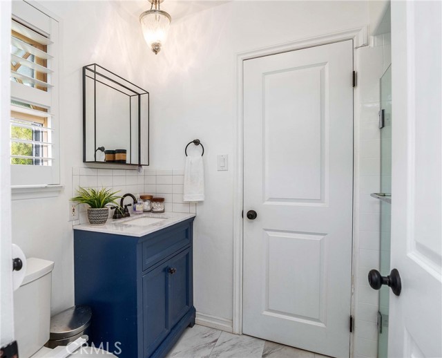 Second bath... fully remodeled with enclosed shower! This bathroom is off the office which could be the master bath if you used the office as a bedroom