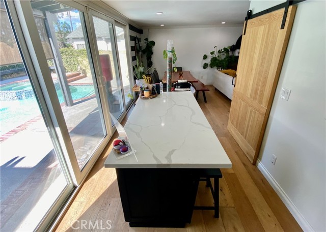 Center island with barn door walk in pantry