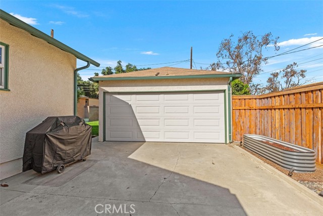 Backyard with 2 Car Garage and additional large storage shed all behind a private gate fence