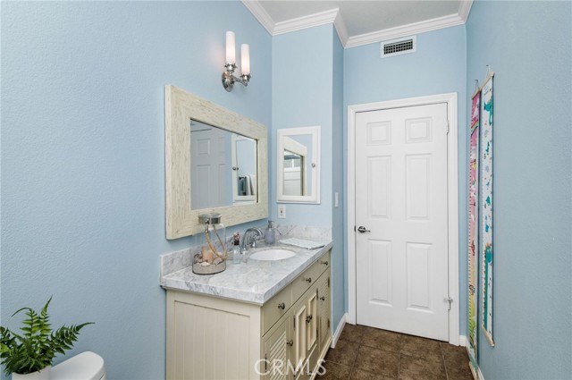 Loving the shell-inspired mirror and vanity.