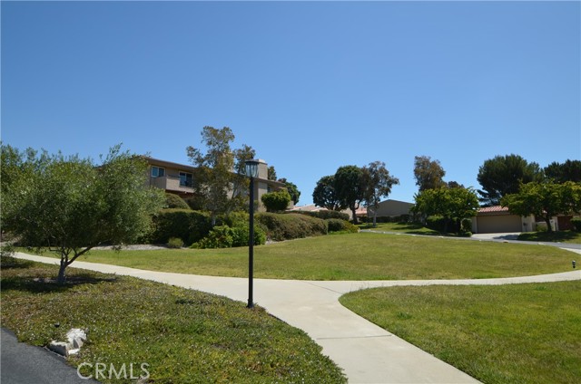 Park-like green grass surrounding the home Park-like green grass surrounding the home