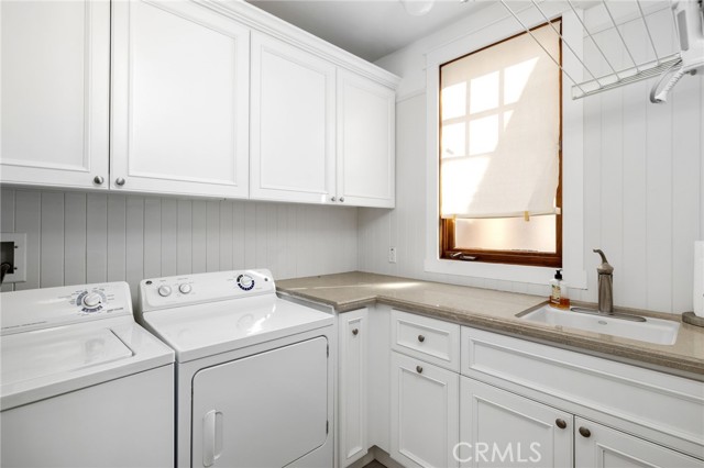 Spacious laundry room with plenty of storage and counter space