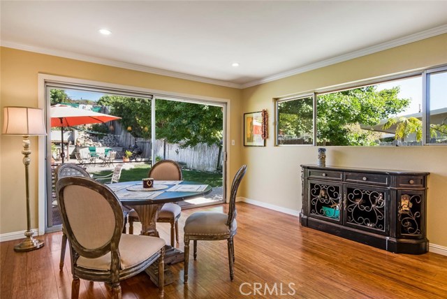 This is the family room area which opens to the kitchen.  Nice large door guide you outside to the enclosed good sized grassy rear yard.