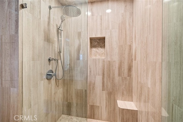 guest shower with shower box and marble tile