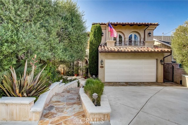 1505 3rd Street Manhattan Beach, California Presenting this spectacular custom-built home with elements of a Spanish/Italian Villa with dramatic cathedral ceilings and sweeping open floor plan that flows from the front courtyard to the back yard oasis, appointed with black-bottom pool, hot tub, built-in barbecue and sunny patio. Mature foliage at the front provides privacy and an elegant front courtyard leads you into the graceful foyer, where you will be enveloped by natural light and gleaming Pecan wood floors throughout the living space and up the spiral staircase. The formal Living Room with dramatic 2-story ceilings with cozy fireplace leads into a formal Dining Room, and the elegant Chef's Kitchen is an entertainer's dream with Breakfast Nook, large center island, bar, double oven, 6-burner stove top with griddle, warming drawer, and walk-in Butler's Pantry. Opening to the warm, open-beamed-ceiling Family Room that flows right out to your exquisite pool area and back yard. Easy access on the main level to the en-suite bedroom plus a powder room. Four large bedrooms upstairs plus a bonus area, well-suited for today's home office. The Master Suite boasts vaulted ceilings, glorious walk-in closet and spa-like bathroom with two-sided fireplace! Two bedrooms share a bathroom while the third en-suite bedroom at the front of the home is conveniently next to the laundry room. Extra bonuses include air-conditioning, whole-house water filter system plus a 3-car garage. Located on a quiet street and close to everything!