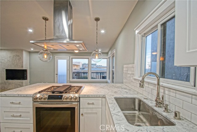 209 15th Street Manhattan Beach, California Gorgeous NEW (Interior) CONSTRUCTION...PANORAMIC WHITE WATER VIEWS...8 houses to the Strand in the heart of fun DOWNTOWN Manhattan Beach!!! A+LOCATION! Be steps away from the ocean & the restaurants & the nightlife yet relax & enjoy the comforts of a beautifully remodeled 3 BEDROOM, 2 BATH SINGLE FAMILY HOME with a BACKYARD & 2 CAR GARAGE. Top of the line everything! A major interior remodel in 2016...NEW WIDE PLANK HARDWOOD FLOORS, ceiling & walls. NEW UPSTAIRS BATHROOM...down to the studs. Invite your friends over for champagne at sunset and watch the sun go down from your ocean view living room and deck. Set up your BBQ in the backyard. GOURMET CHEF'S KITCHEN w/marble countertop. COOL FIREPLACE. WALK-IN closet in downstairs SPACIOUS MASTER. AIR CONDITIONED. Luxury living day or night. This is the way to live!