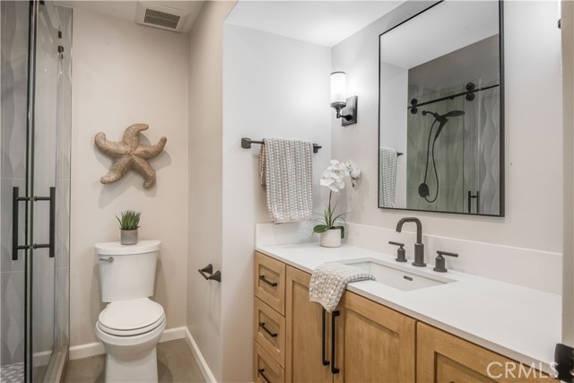 Inviting main floor bathroom with large shower.