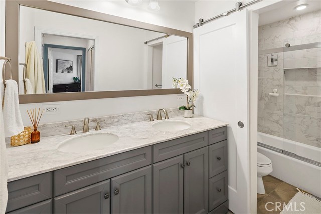 Beautifully updated bathroom with double sinks. Beautifully updated bathroom with double sinks.