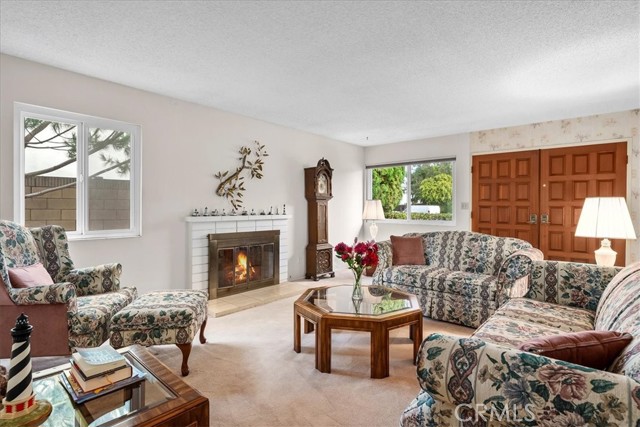 Living room gets nice morning sun and has a fireplace