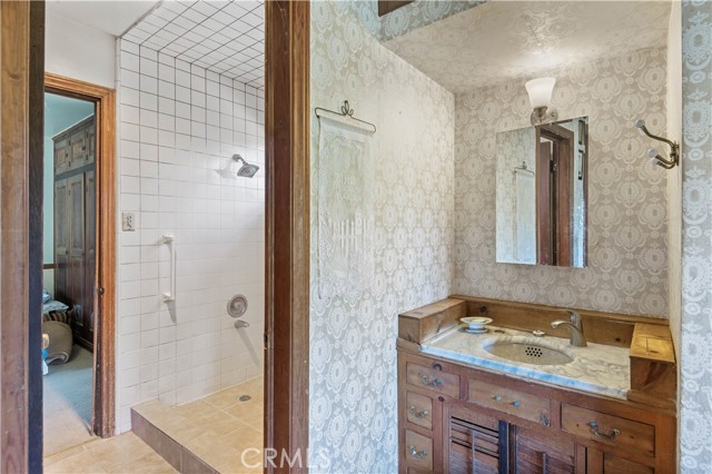 Marble sink, walk-in shower between 2nd to 3rd bedroom.